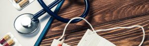 Stethoscope and medical supplies on table